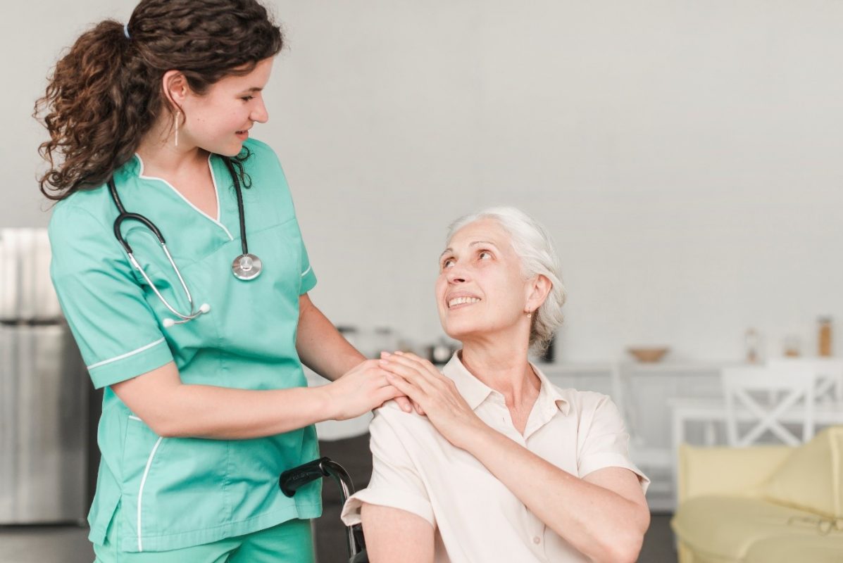 Elderly woman with carer