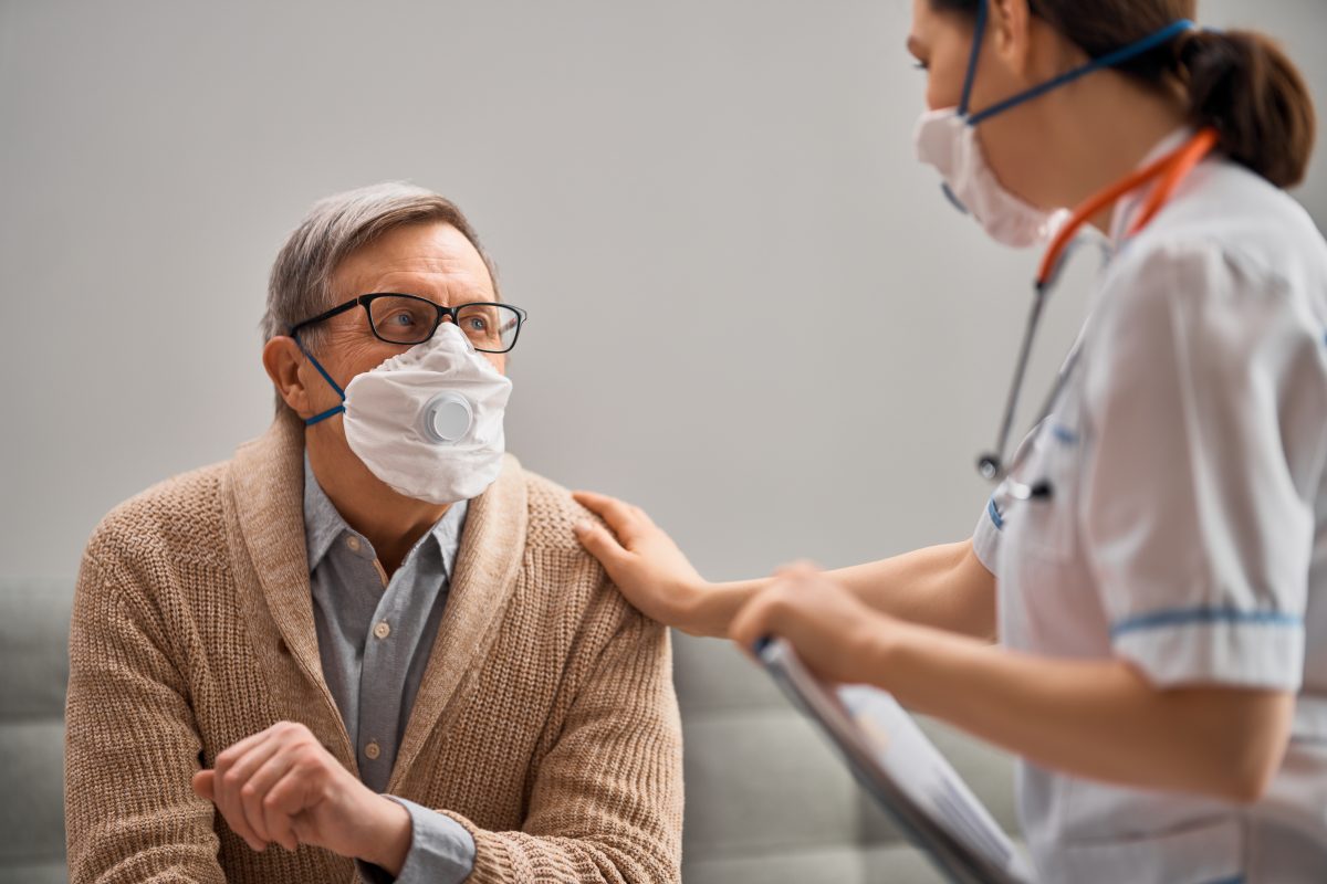 Elderly man with nurse